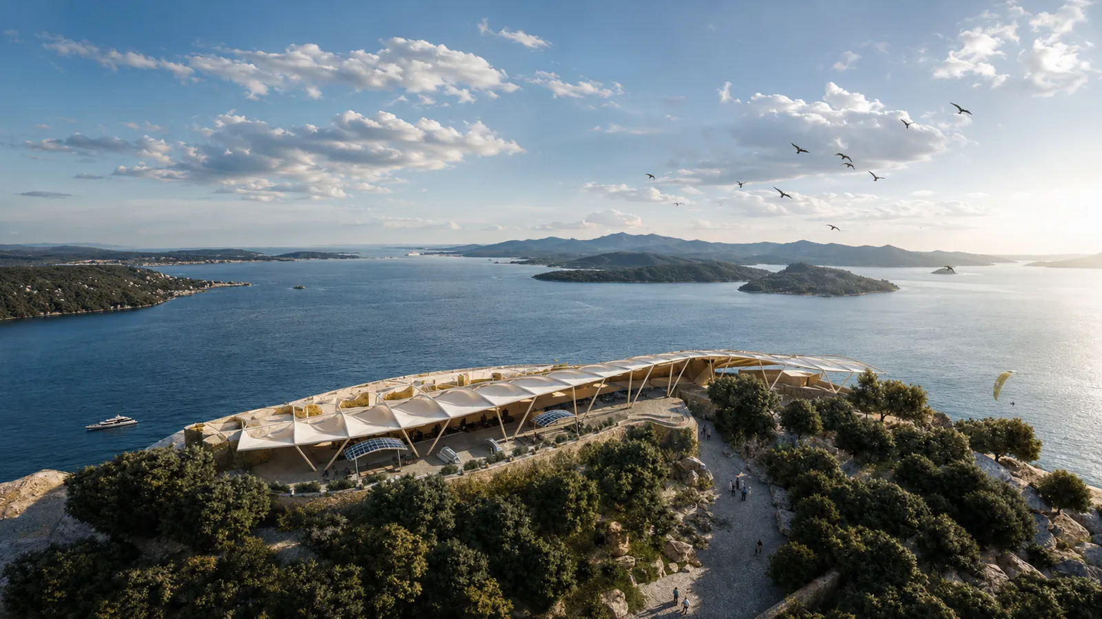 Aerial view of a tensile canopy on a headland above a bay with islands